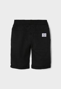 Black shorts made from soft fabric, featuring an elastic waistband and a single back pocket with a branded tag. Cuffed hem detail.