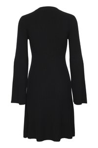 Black ribbed knit dress featuring long sleeves, a rounded neckline, and side slits at the hem for ease of movement.