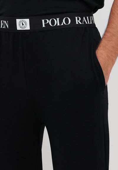 Czarne bawełniane spodnie dresowe o miękkiej fakturze, z kontrastowym haftowanym paskiem w talii z logo "POLO RALPH LAUREN".