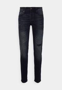 Tmavě modré slim fit džíny s mírným opotřebením na levém stehně a koleni, s tradičním pětikapsovým designem a zapínáním na knoflík.