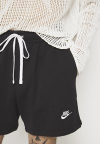 Nike Sportswear FT FLOW - Pantalon de survêtement - black/white