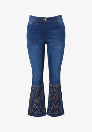 Denim flared jeans in dark blue with intricate orange embroidered patterns at the hem. Features a standard waistband and zip fly.