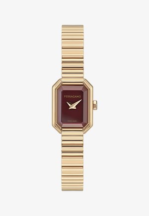 Guldfarvet Ferragamo kvinders armbåndsur med rektangulær bordeauxfarvet urskive, guldvisere og fleksibel ribbet metalrem.