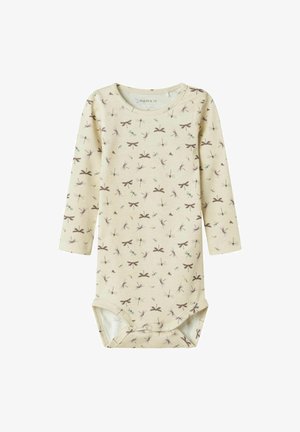 Long-sleeve baby bodysuit in light beige cotton, featuring a pattern of small dragonflies and bows in purple and blue tones. Snap closure at bottom.