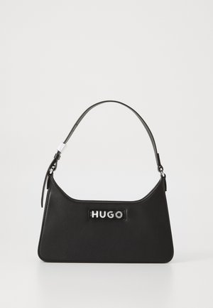 Black leather handbag with a curved design, silver hardware, and a prominent "HUGO" logo on the front. Smooth texture and structured shape.