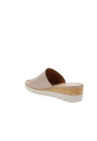 Kurk platform instapsandaal met een gladde lichtbeige bovenkant, ronde neus en witte gestructureerde zool met meerdere groeven.