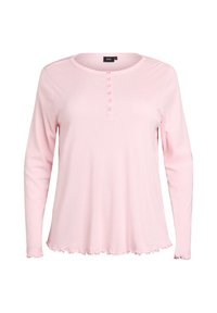 Šviesiai rožinė ilgomis rankovėmis marškinėliai su apvaliu iškirpimu, turintys sagų užsegimą ir raukšlėtą apatinę dalį. Pagaminta iš minkštos medžiagos.