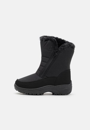 Black winter boot with fur lining, side zipper, thick tread sole, and padded upper for insulation and grip.
