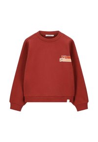 Sweatshirt rouge avec un col rond, des épaules tombantes, des poignets côtelés et un ourlet côtelé. Présente un petit graphique dans des couleurs contrastées à l'avant.