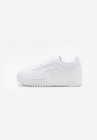 White platform sneakers with a smooth leather texture, perforated detailing, and flat laces; features a thick white rubber sole.