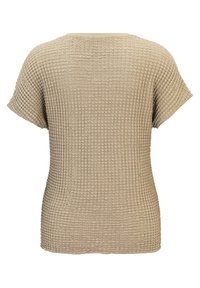Haut beige à manches courtes avec texture en maille gaufrée, présentant des manches légèrement larges et un ourlet droit, vu de dos.