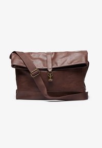 Brown leather messenger bag with a fold-over flap, adjustable strap, metal hardware, and a smooth finish. Includes a front closure with a loop.