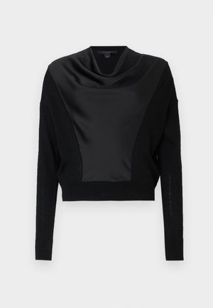 Black cropped sweater featuring a satin cowl neck, long sleeves, and a textured knit. The bodice has a contrasting matte finish detail.