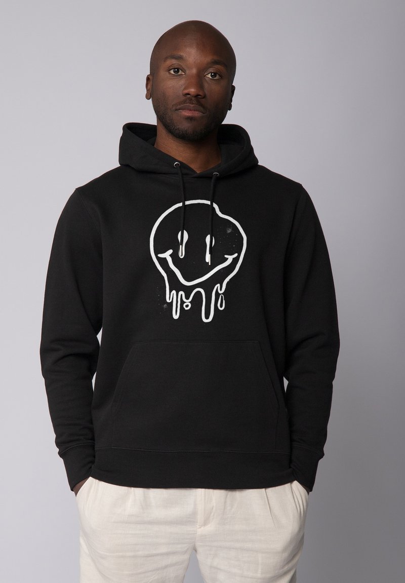 Schwarzer Hoodie mit weißem, tropfendem Smiley-Gesicht-Graphic, verstellbarem Kordelzug und Fronttasche. Weicher Stoff, lockere Passform, lange Ärmel.