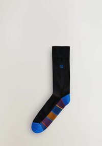 Calzino nero con punta blu e righe colorate a fantasia in viola, arancione e blu. Presenta un piccolo logo blu sul lato superiore.