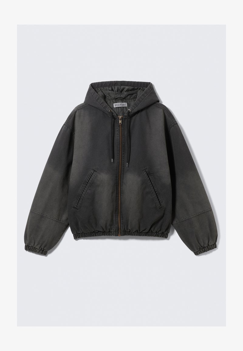 Grauer Kapuzenpullover zum Reißverschluss, mit Kapuze, elastischen Bündchen und Saum. Verfügt über zwei Seitentaschen und einen dezenten Glanz im Stoff.