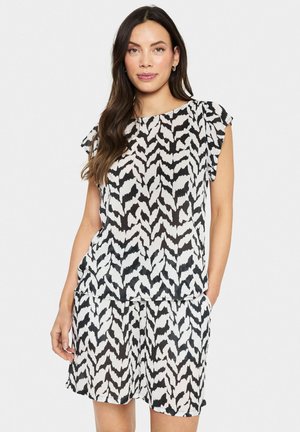 Black and white patterned top with short sleeves, featuring a loose fit and textured fabric, paired with matching shorts.