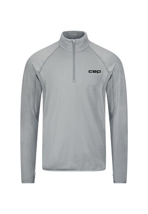 Polo de sport gris clair à manches longues avec une fermeture éclair au quart et le logo "cep" sur le côté gauche de la poitrine, conçu pour le sport ou un usage décontracté.
