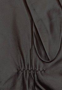 Black leather glove with a smooth texture, featuring gathered stitching at the wrist and a seamless design. Soft, durable material enhances grip.