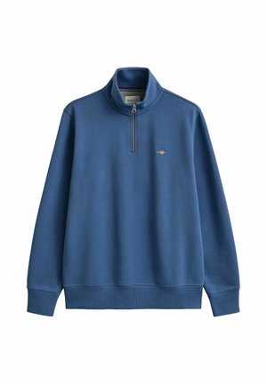 Blue long-sleeve pullover with a quarter zipper, high collar, ribbed cuffs, and a small GANT logo on the chest.