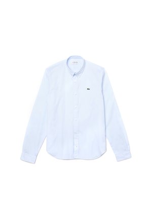 Light blue button-up shirt made of cotton, featuring a classic collar, long sleeves, and a small green Lacoste logo on the chest.