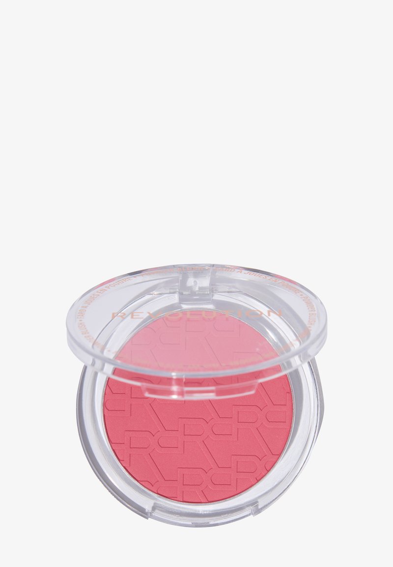 Round compact of pink powder blush with transparent plastic lid partially open showing embossed brand initials.