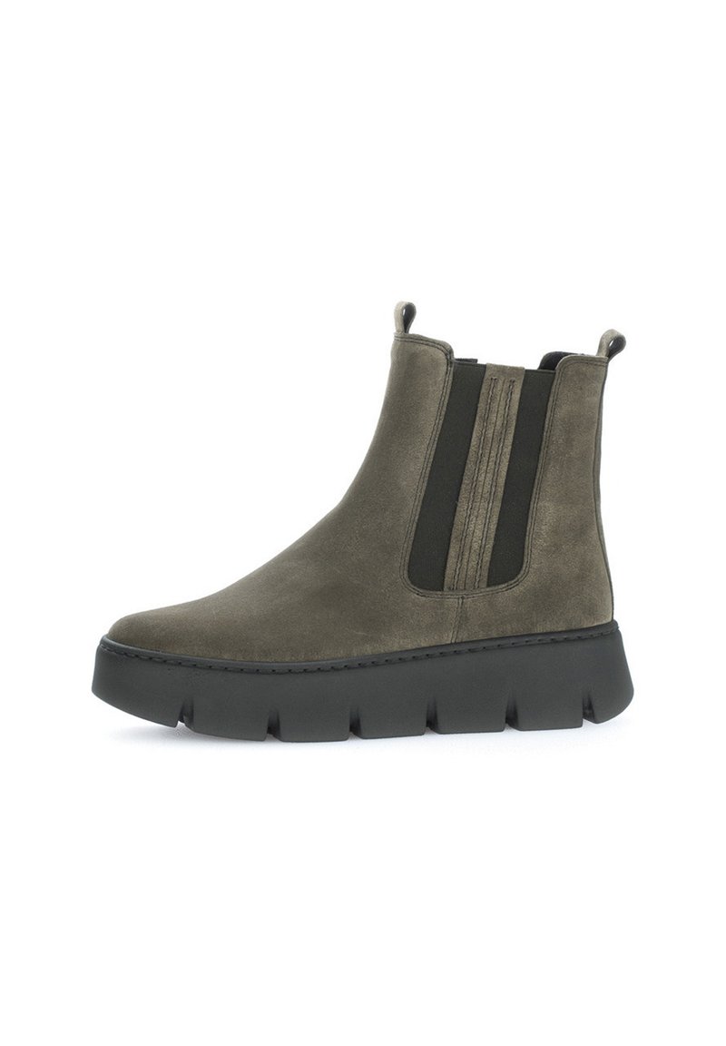 Olive green suede ankle boots with black elastic side panels and a thick black rubber sole featuring a tread pattern for grip.