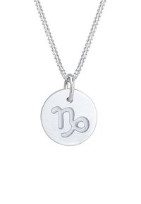 Silberne Halskette mit einem runden Anhänger. Der Anhänger ist mit dem Zodiac-Symbol für Steinbock in einem glatten, polierten Finish graviert.