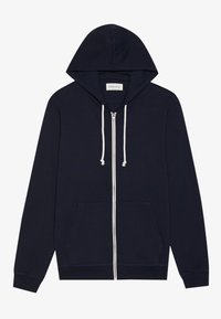 Mornarska zip-up dukserica s vezicama, prednjim džepovima i rebrastim manžetama. Glatka tkanina, jednostavan dizajn, s belim zatvaračem.
