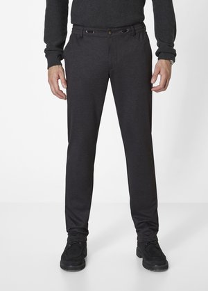 Dark grey slim-fit trousers with a smooth texture, featuring a button closure and drawstring accents, paired with black shoes.