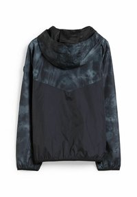 Chaqueta negra ligera con capucha de tie-dye. Puños y dobladillo elásticos, con una textura suave y un diseño sencillo.