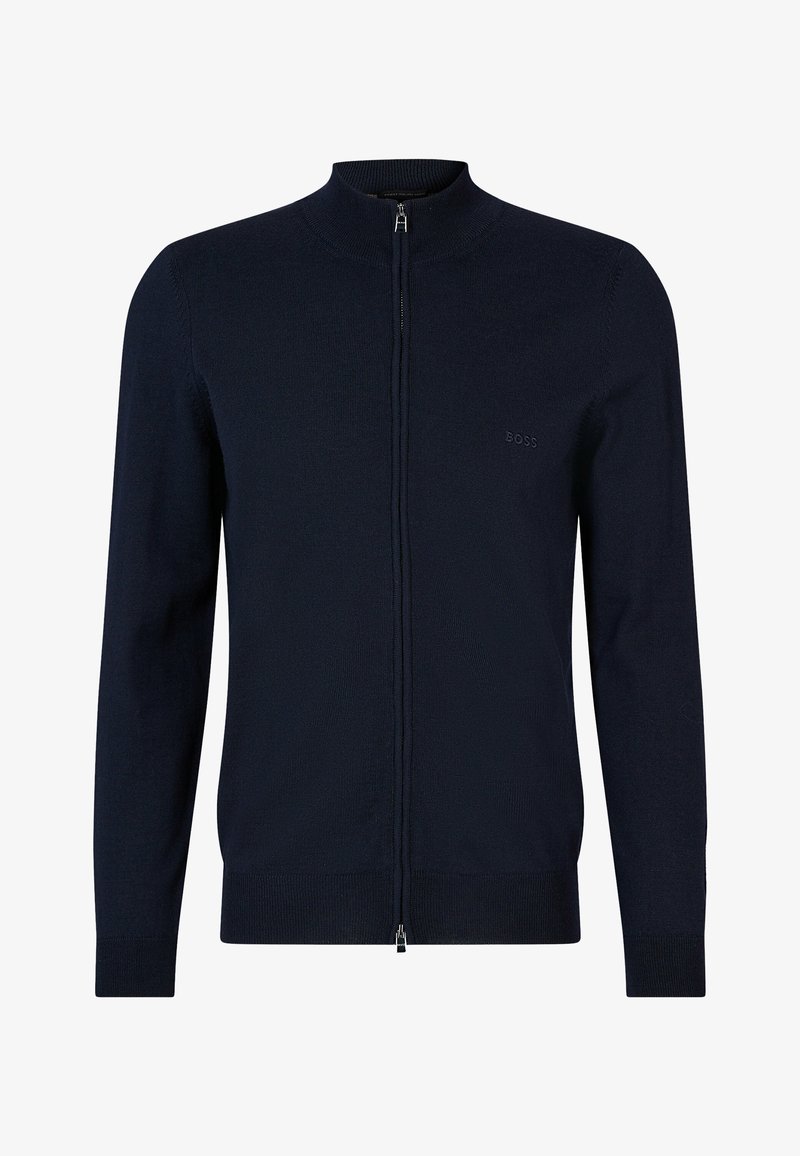 Jūros laivyno zip-up megztinis, pagamintas iš minkštos mezginio medžiagos, pasižymintis aukštu apykakle, minkštais rankogaliais ir subtiliu logotipu ant krūtinės.