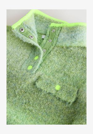 Grüner Wolle-Impuls-Pullover mit einer strukturierten Oberfläche, neongrünen Akzenten, Druckknöpfen und einer Brusttasche mit einem auffälligen Knopfdetail.