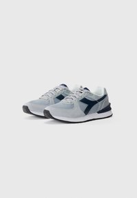 Gray athletic shoes with mesh and suede materials, featuring a navy accent, lace-up closure, and a rubber sole with textured tread.