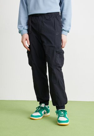 Nike Sportswear TECH WOVEN - Cargo trousers - black