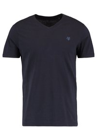 Námořnická modrá polokošile s krátkým rukávem a výstřihem do V, s malým světle modrým vyšitým logem na levé hrudi.