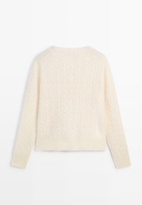 Cream cable-knit sweater with a rounded neckline and long sleeves. Features textured pattern and ribbed cuffs and hem.