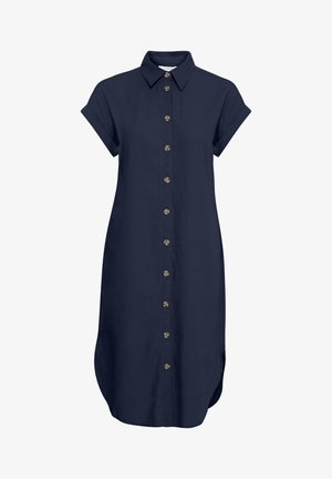 Tumši zila lina krekla kleita ar pogām priekšpusē, īsām piedurknēm un sānu kabatām. Raksturo apaļa apakšmala un zelta tonētas pogas.