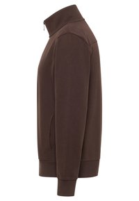 Brown zip-up sweatshirt with a high collar, side pockets, ribbed cuffs and hem. Soft fabric with a smooth texture, minimalistic design.