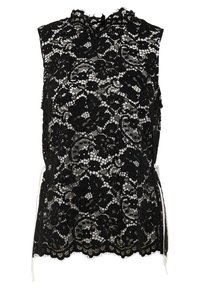 Black lace top with sleeveless design, floral patterns, scalloped hem, and white tie accents at the waist. Textured, sheer fabric.