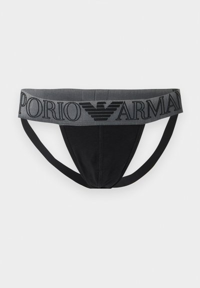 Μαύρο ανδρικό jockstrap με φαρδιά γκρι μέση που φέρει το λογότυπο "Emporio Armani" και έμβλημα αετού, σε απλό λευκό φόντο.