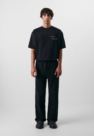 Don't Waste Culture NADIYA UNISEX - Verryttelyhousut - black