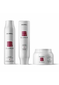 Three Goldwell Elumen hair care products: a white shampoo bottle, a white conditioner tube, and a white mask jar, featuring red accents and text.