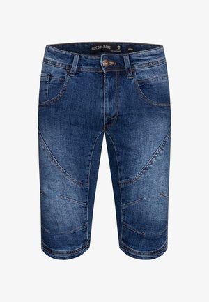 Sötétkék farmer rövidnadrág kopott hatással, több zsebbel és ferde varrási részletekkel. Gombos záródás deréknál. Combközépig érő hosszúság.