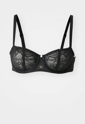 Black lace bra featuring underwire, detailed floral patterns, adjustable straps, and a small decorative clasp at the front.