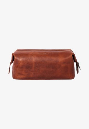 Brown leather toiletry bag with a rectangular shape, smooth texture, and a zippered closure. Features subtle branding on the front.
