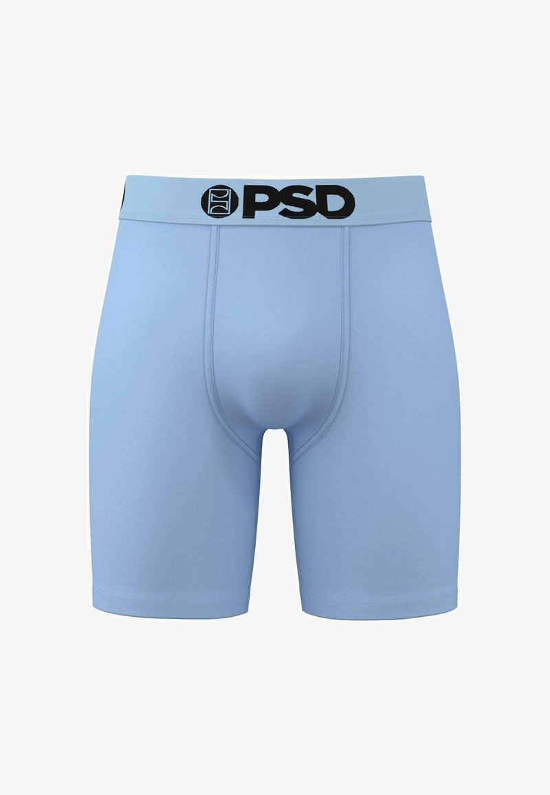 Light blue boxer briefs with black "PSD" logo on elastic waistband. Smooth fabric, fitted design with mid-thigh length and no visible patterns.