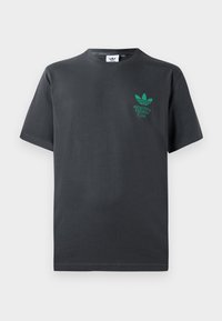 T-shirt en coton noir avec un col rond, des manches courtes, et un logo vert comportant les mots "CLUB SANTÉ & FITNESS" et un design de trois feuilles.