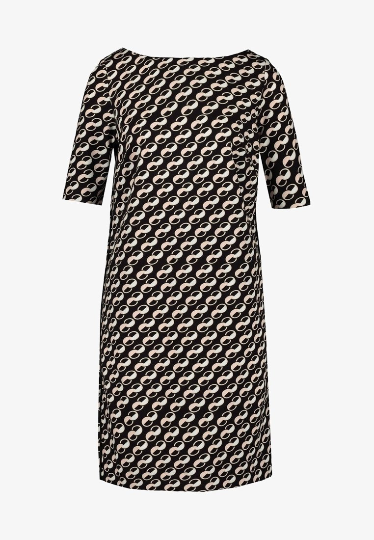 Robe noire hauteur genou avec manches à coudes, arborant un motif en chaîne ovale beige et rose clair se répétant.