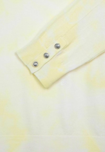 Hellgelbes, geripptes Langarmshirt mit einem Batik-Effekt und vier metallischen Knöpfen an den Bündchen. Dezentes Logo nahe dem Saum.